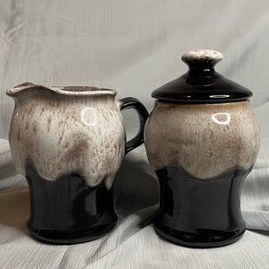 Art pottery glazed sugar bowl and creamer.